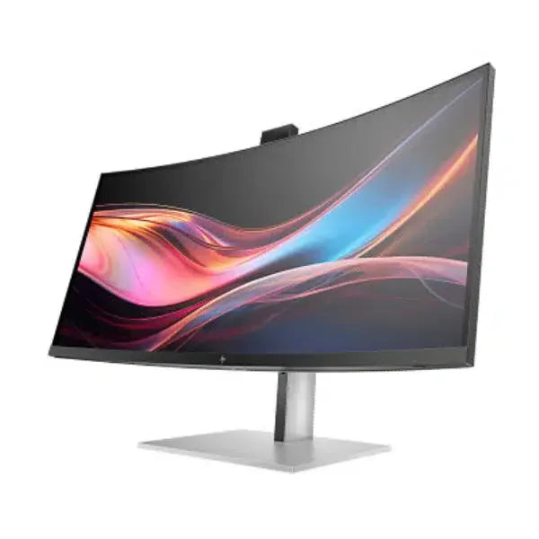 Curved ultra-wide computer monitor with vibrant display on a silver stand