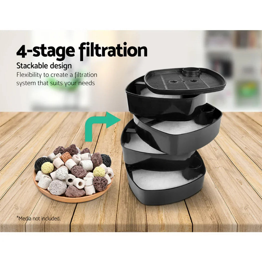 Stackable 4-stage aquarium filter trays with ceramic and bio media on a wooden table