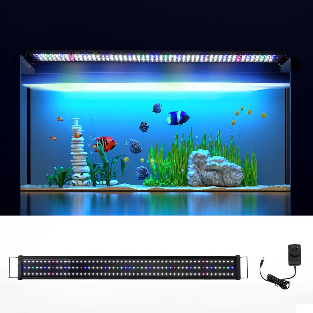 LED aquarium light with power adapter, illuminating a fish tank with plants and colorful fish