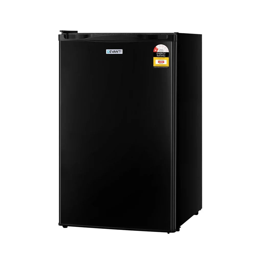 Black compact bar fridge with energy rating sticker on white background