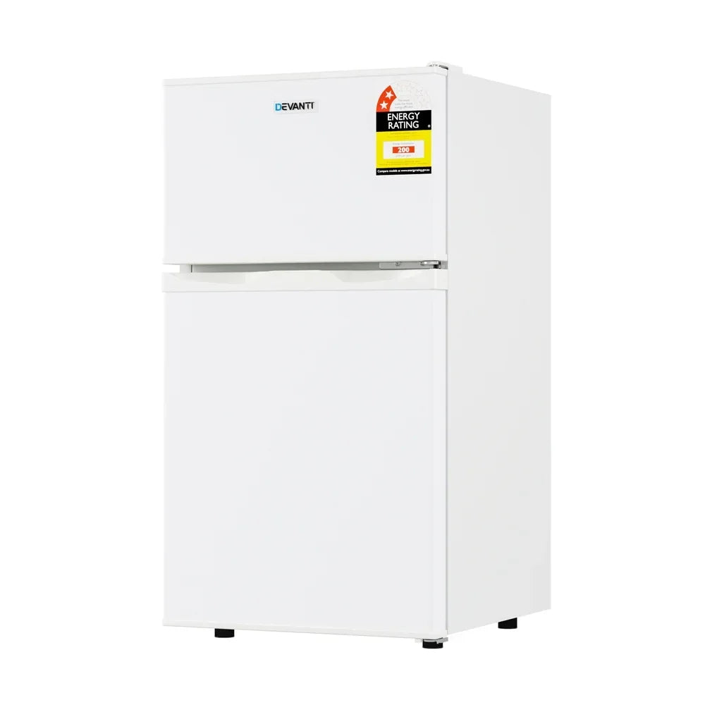 White two-door top mount fridge with energy rating label, freestanding refrigerator