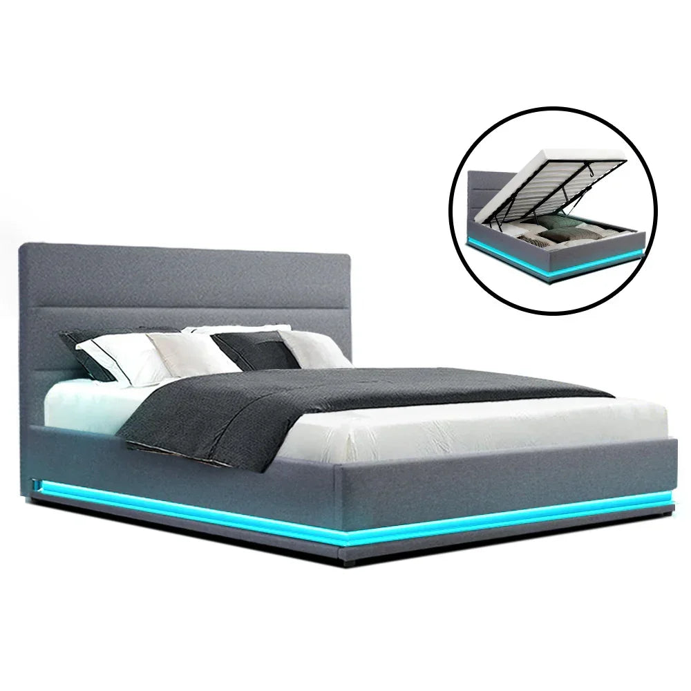 Modern grey LED bed frame with storage and blue accent lighting, neatly made bed.