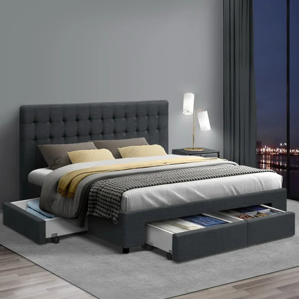 Modern queen bed frame with dark grey upholstery and multiple storage drawers in a stylish bedroom