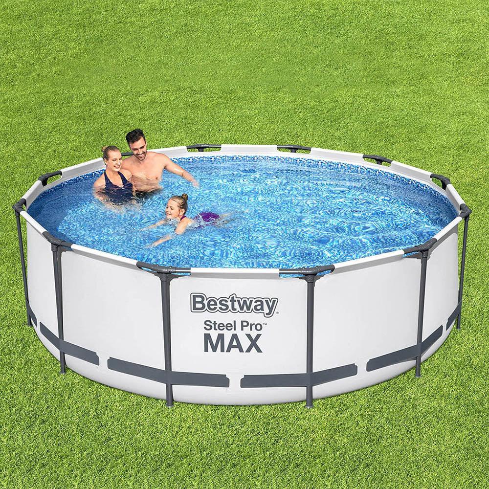 Family enjoying a round above ground steel frame swimming pool on green grass