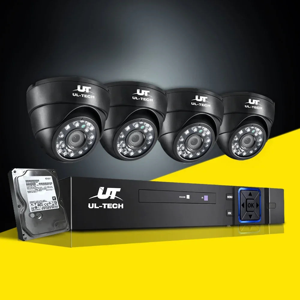 Four black UL-Tech dome security cameras with DVR system and hard drive on a yellow background.