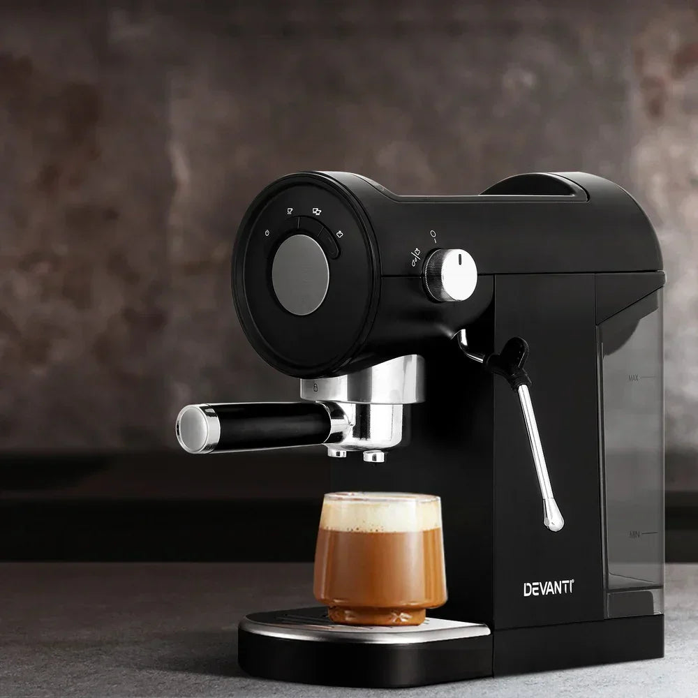 Black espresso coffee machine with milk frother brewing cappuccino in glass cup