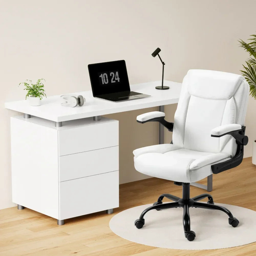 Modern white office desk with drawers and ergonomic white office chair in a home workspace