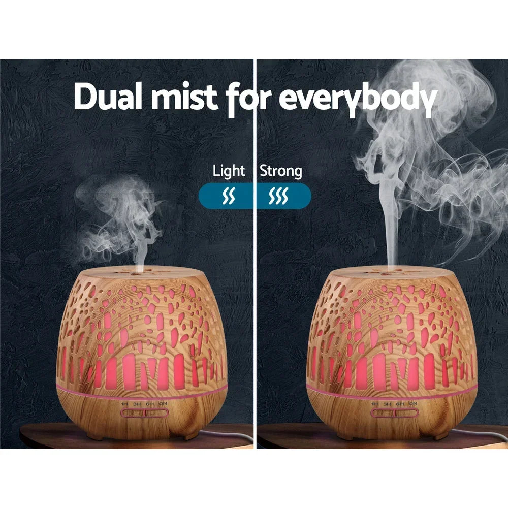 Wood grain essential oil diffuser showing light and strong mist modes with LED lights.