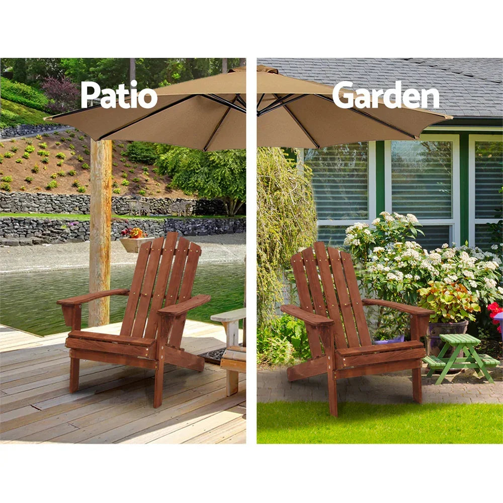 Wooden Adirondack chair shown on patio by water and in garden with flowers, under umbrella