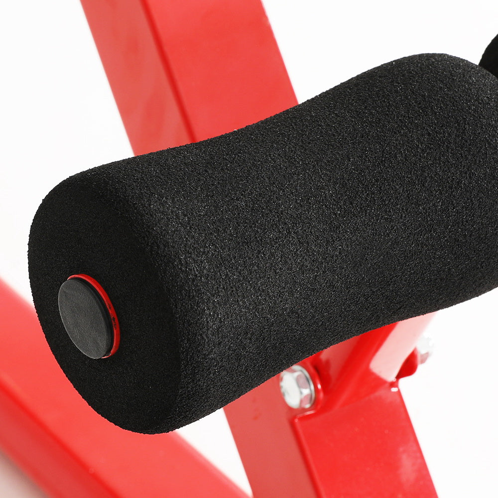 Red home gym bench with black foam padding and adjustable settings for workout routines