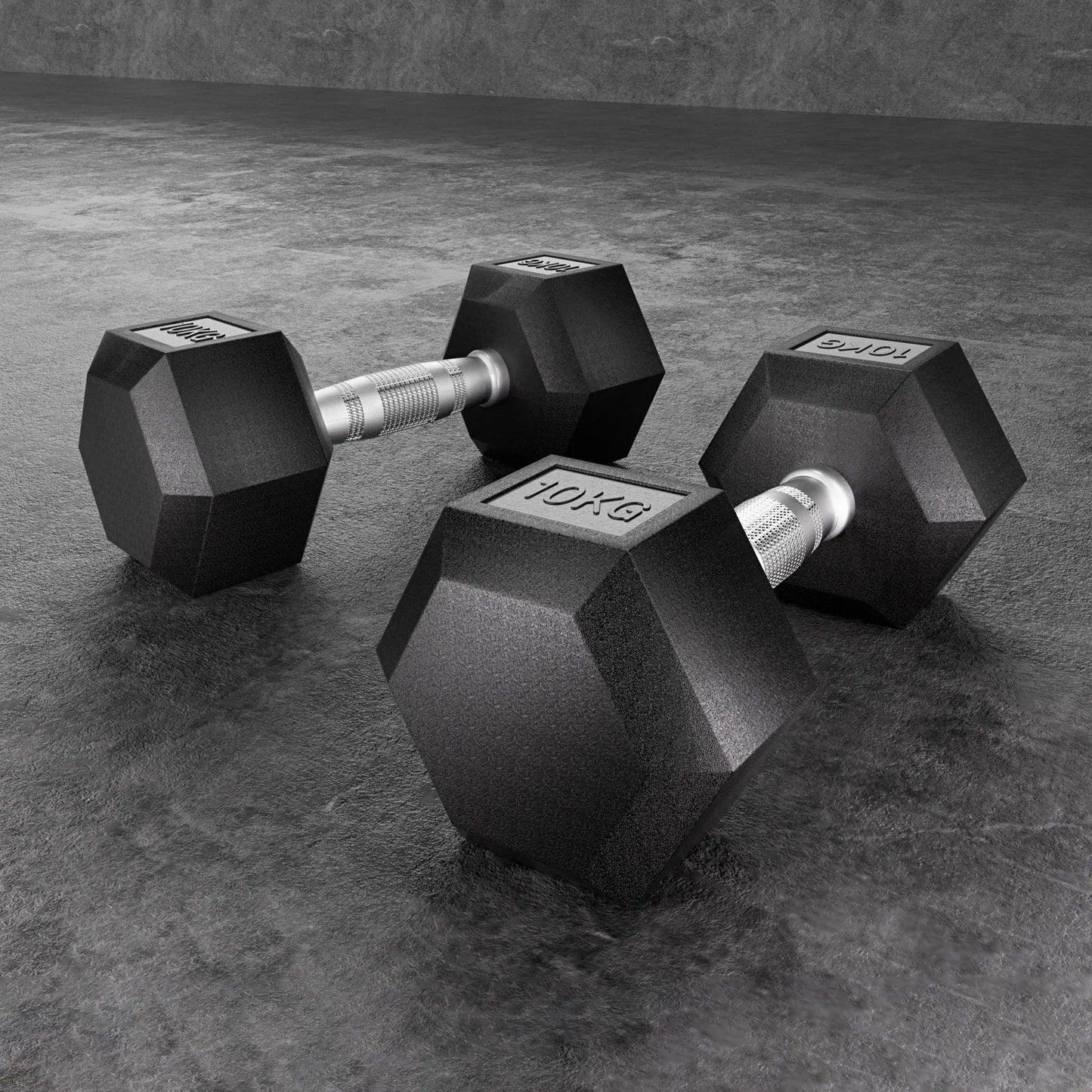 Pair of 10kg hex dumbbells with black rubber coating on a gym floor