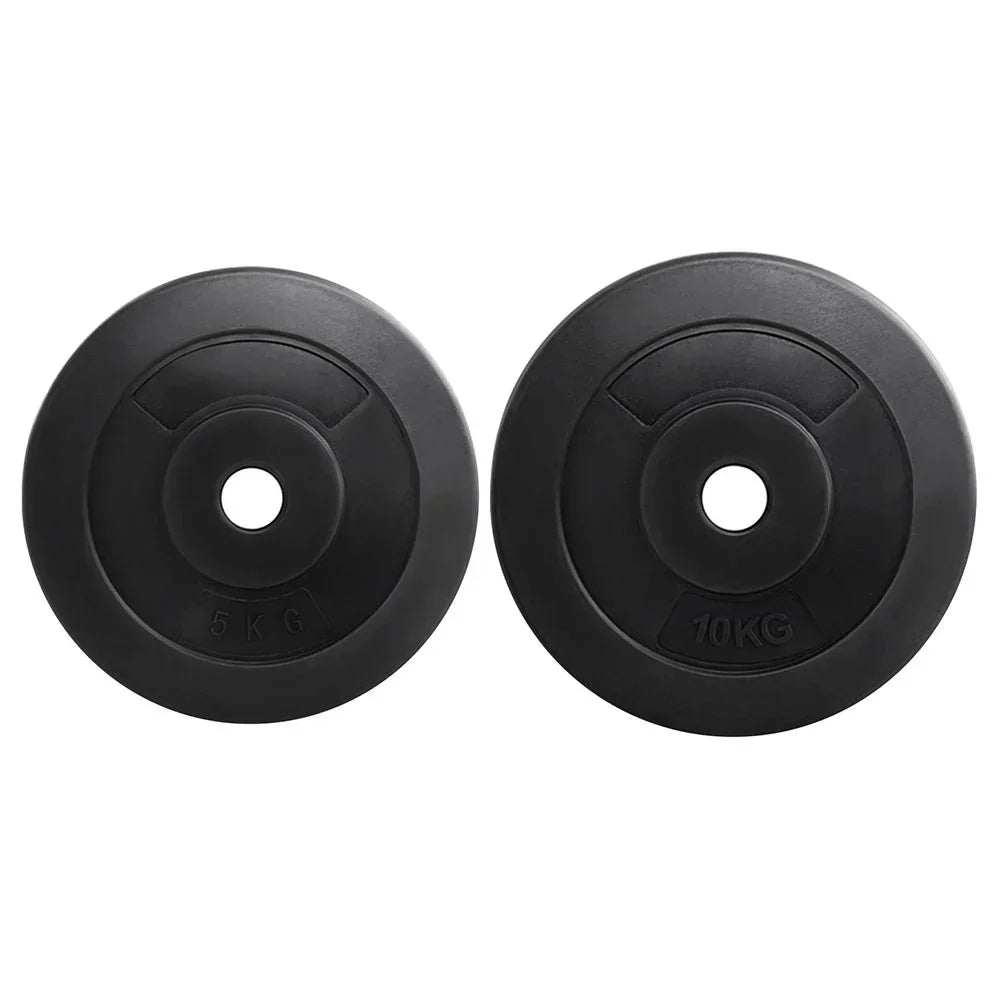 Pair of black rubber weight plates, 5kg and 10kg, with round center holes