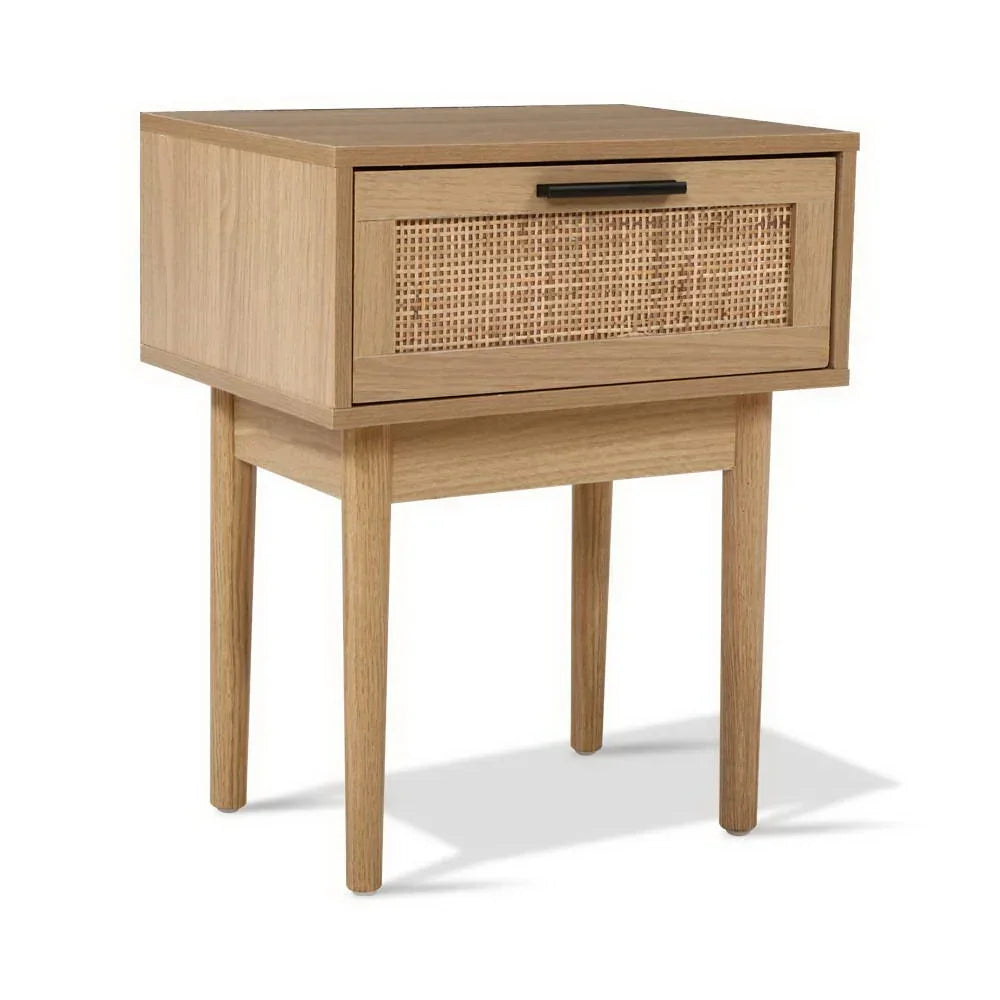 Scandinavian style wooden bedside table with rattan drawer front and four tapered legs