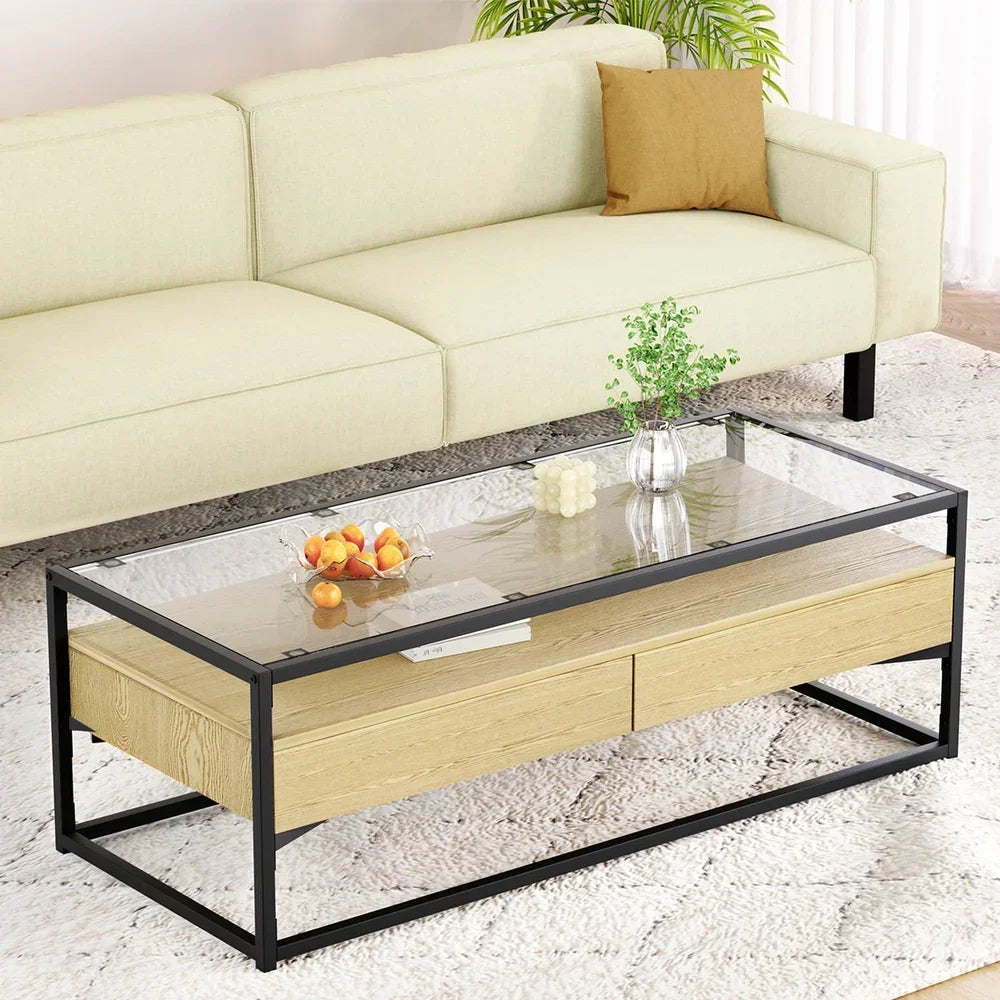 Modern glass and wood coffee table with black metal frame in a living room setting