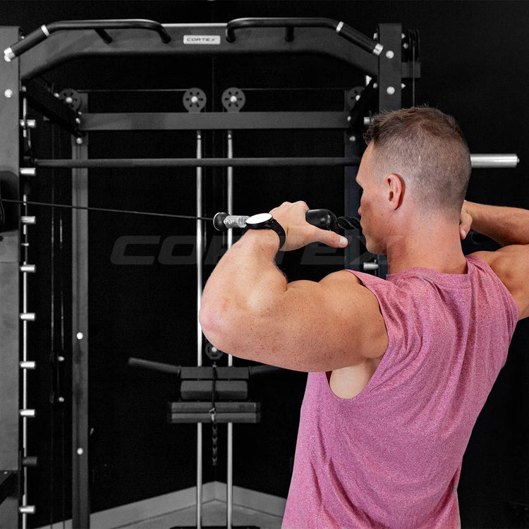 Adjustable weight bench with barbell set in a bright home gym, gray flooring, large windows