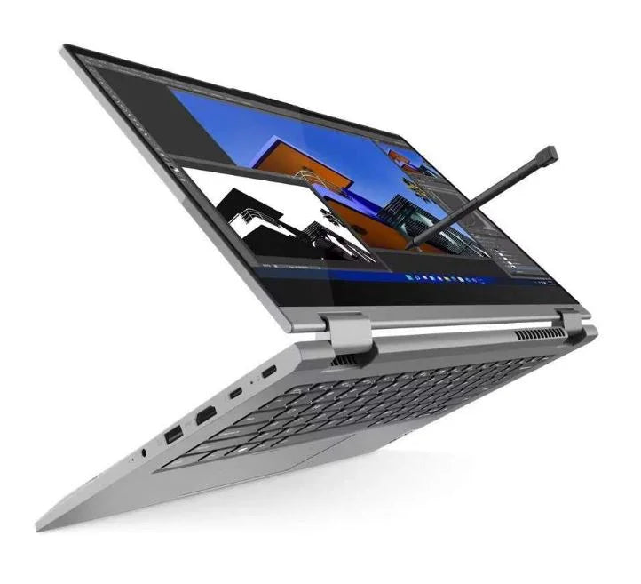 Silver 2-in-1 convertible laptop with stylus pen and architectural design software on screen