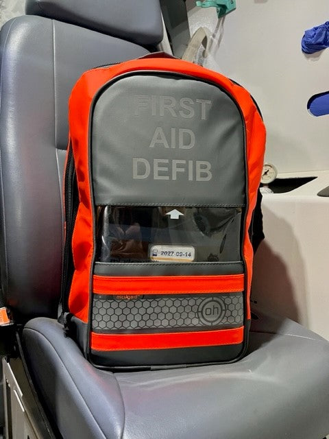 Trauma backpack with a padded harness that can be stowed for quick vehicle deployment, approx 2.5 kg loaded