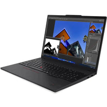 Black laptop displaying photo editing software with vibrant architecture images on screen