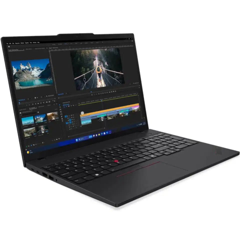 Black laptop displaying video editing software with mountain and bridge clips on screen
