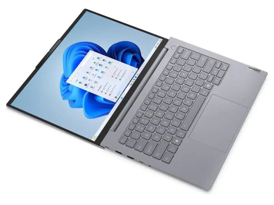 Silver Lenovo laptop with Windows 11 interface, sleek design, ideal for work or study