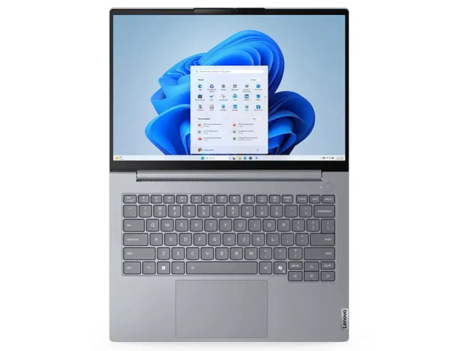 Silver Lenovo laptop with Windows 11 interface, sleek design, and full keyboard