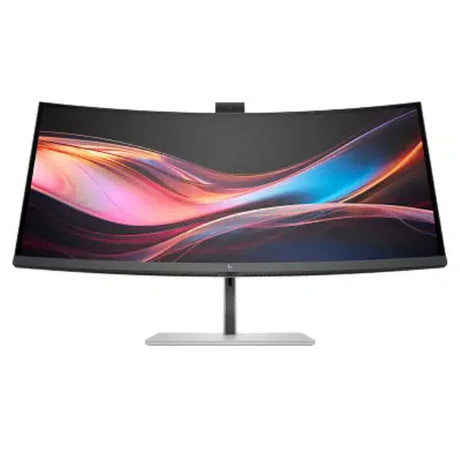 ultrawide curved computer monitor with colorful display on silver stand