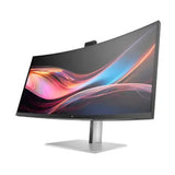 Curved ultra-wide computer monitor with vibrant display on a silver stand