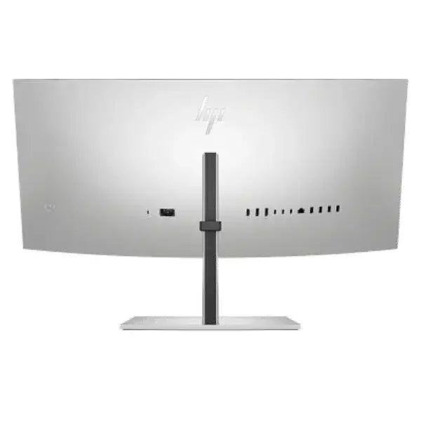 Back view of curved ultra-wide computer monitor with multiple ports and silver stand