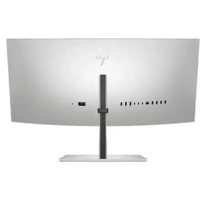 Back view of curved ultra-wide computer monitor with multiple ports and silver stand