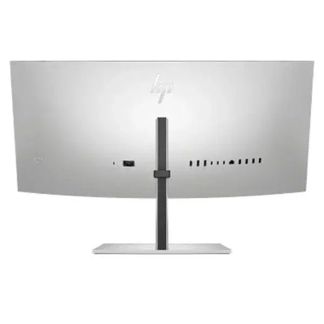 Back view of curved ultra-wide computer monitor with multiple ports and silver stand