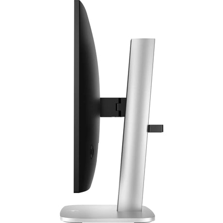 Side view of a slim computer monitor with a silver stand on a white background