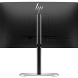 Back view of a black HP computer monitor on a silver stand showing multiple ports