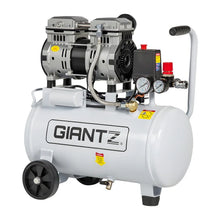 White portable air compressor with pressure gauges and wheels, suitable for workshops or garages.