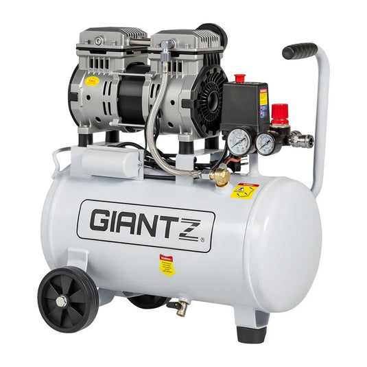 White portable air compressor with pressure gauges and wheels, suitable for workshops or garages.