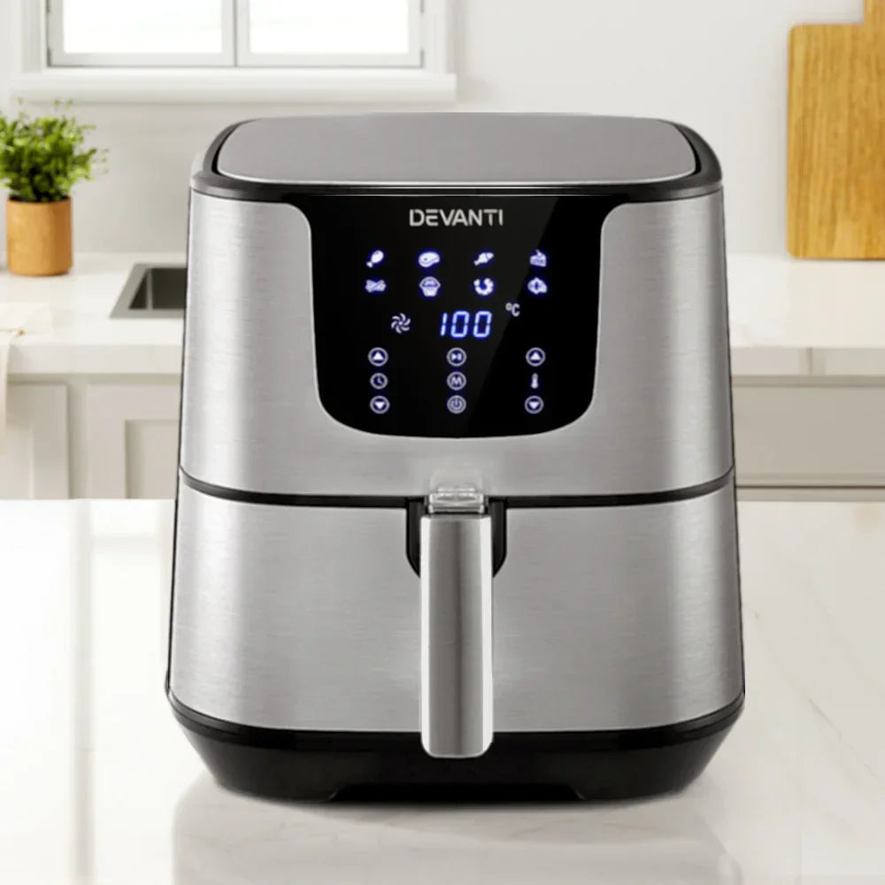 Stainless steel air fryer with digital touchscreen display on kitchen counter