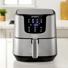 Stainless steel air fryer with digital touchscreen display on kitchen counter