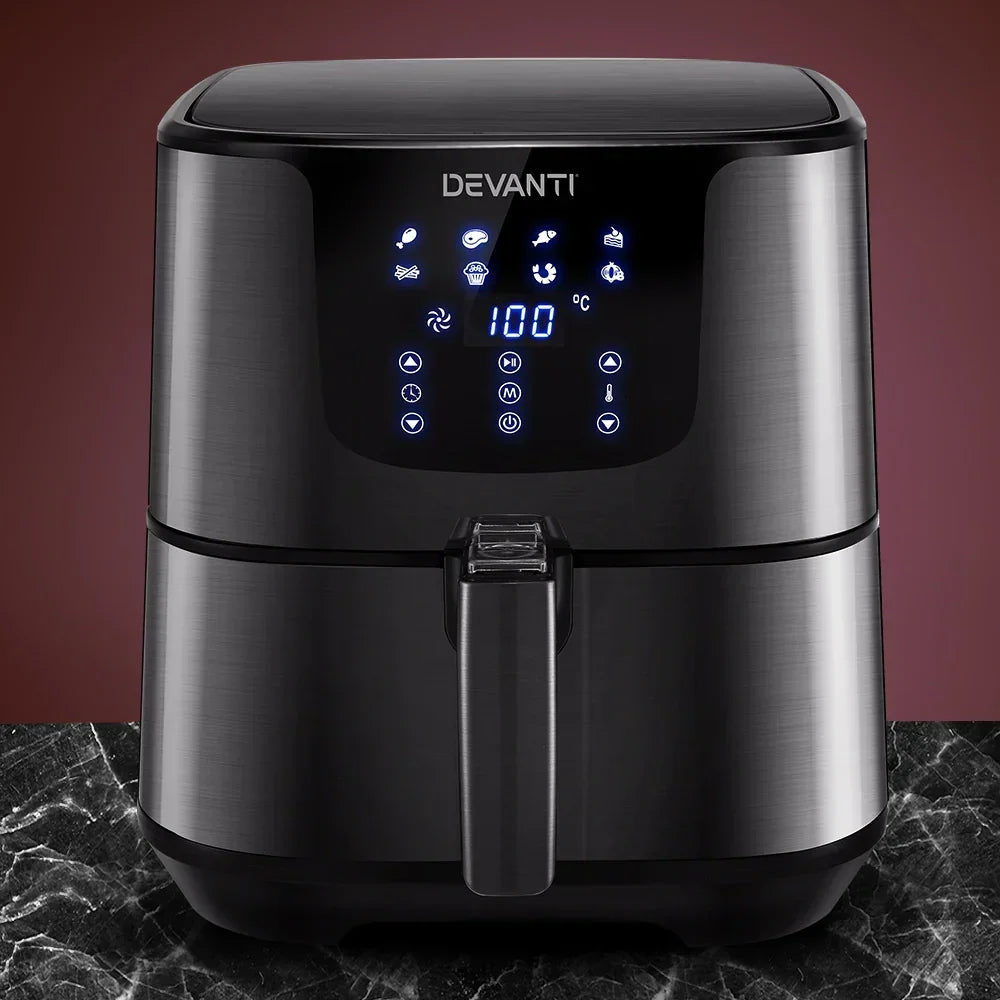 Black digital air fryer with LED touchscreen controls on marble countertop