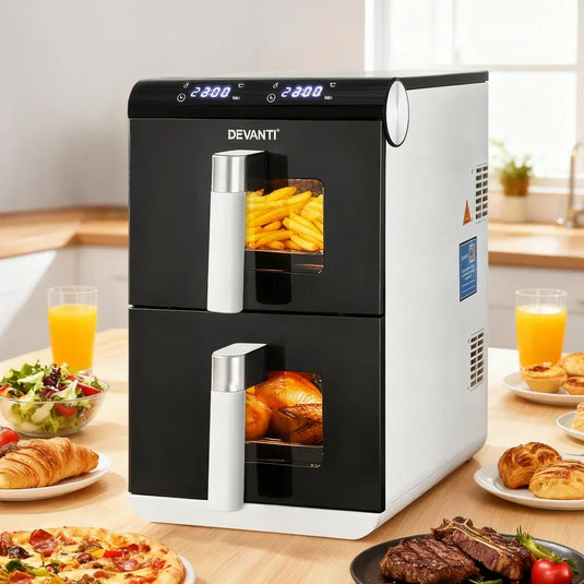 Dual drawer air fryer oven in kitchen, cooking fries and roasted chicken, surrounded by food.