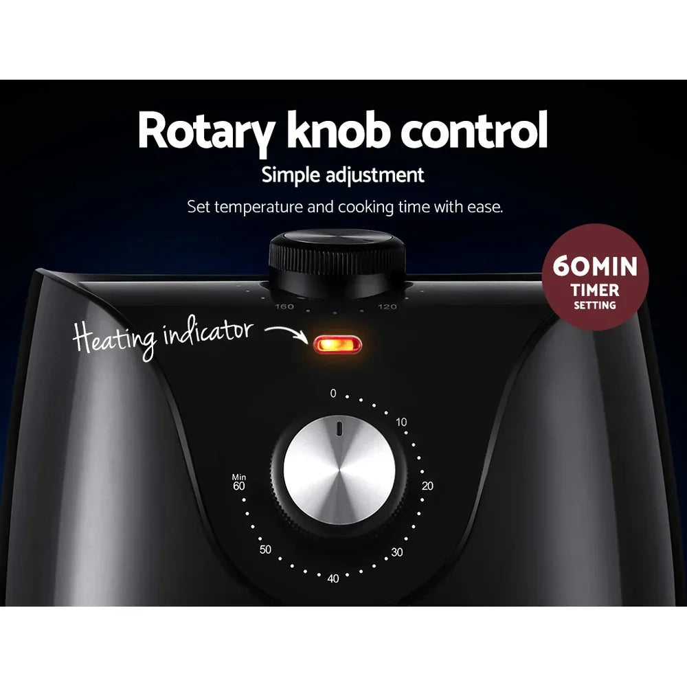 Black appliance with rotary knob control, timer dial, and heating indicator light
