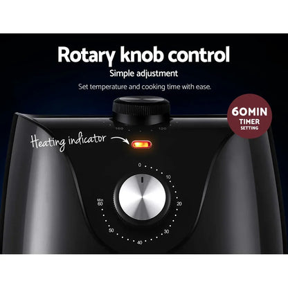 Black appliance with rotary knob control, timer dial, and heating indicator light