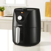 Black Devanti air fryer with timer dial on kitchen countertop, modern appliance design