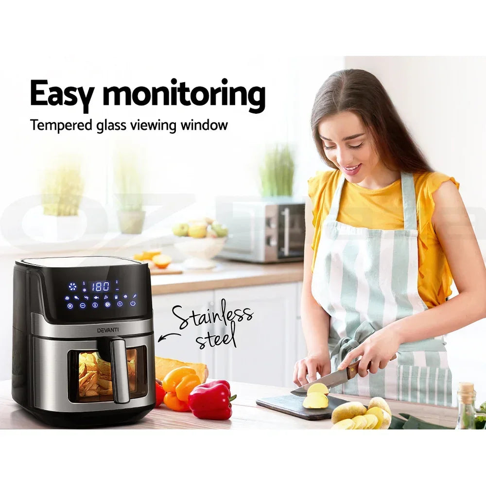 Woman slicing potatoes in kitchen with stainless steel air fryer and digital display