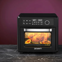 Black digital air fryer oven with roast chicken inside on marble counter