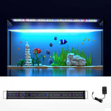 LED aquarium light with power adapter, illuminating a fish tank with plants and colorful fish