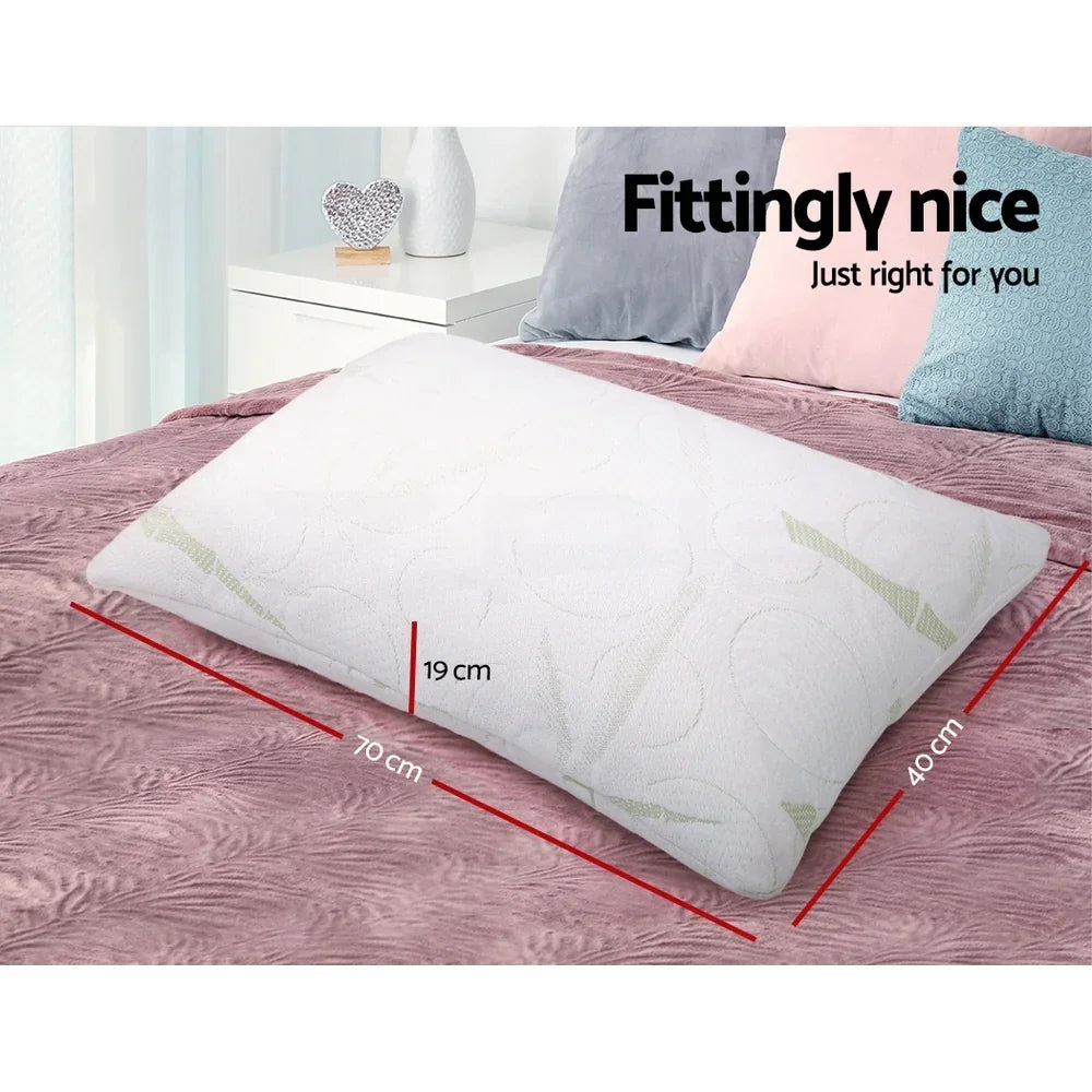 Rectangular white pillow on a bed with size dimensions 70cm x 40cm x 19cm shown