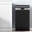 Black slimline freestanding dishwasher with control panel in modern kitchen setting