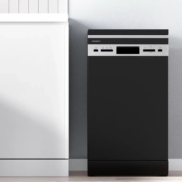 Black slimline freestanding dishwasher with control panel in modern kitchen setting