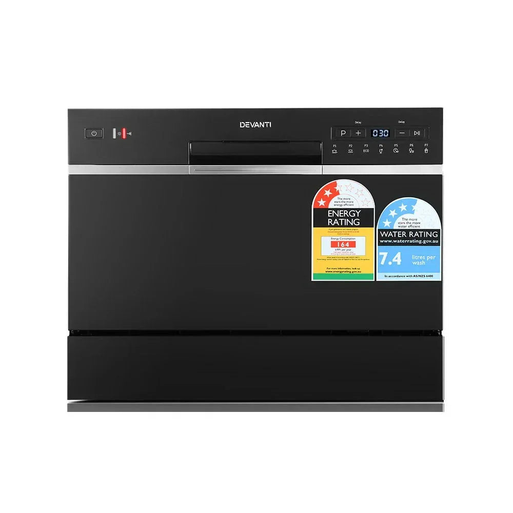 Black countertop dishwasher with digital controls, energy and water rating labels visible on front.
