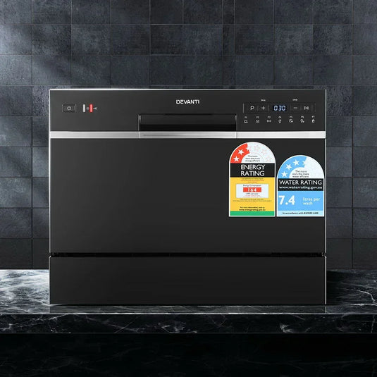 Black benchtop dishwasher with control panel, energy and water rating stickers, modern kitchen