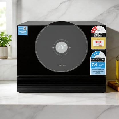 Devanti black microwave with digital display, energy and water rating labels on marble countertop